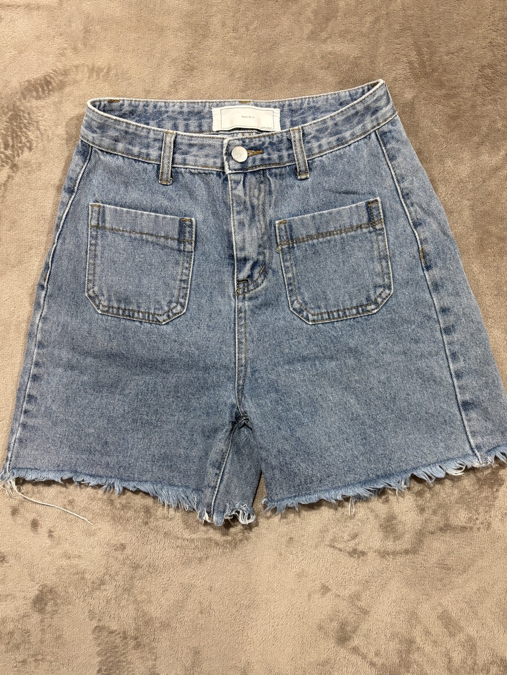 High-Rise Light Blue Denim Cutoff Shorts with Front Patch Pockets